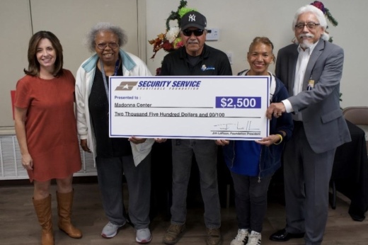 From left: Brandy Ralston-Lint, senior vice president of corporate communications for Security Service Federal Credit Union, presents AARP representative Valerie Robinson, Madonna Center employees Antonio Martinez and Maria Aleman, and Madonna Center Executive Director Roger Caballero with a donation for $2,500. (Courtesy Security Service Federal Credit Union)