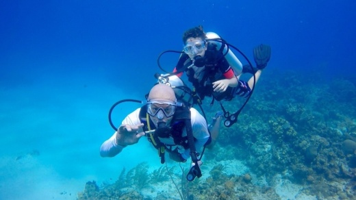 Two divers underwater scuba diving