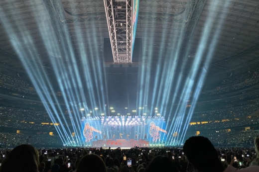 Taylor Swift sings "Ready for it...?" while wearing an outfit with snakes on it at The Eras Tour
