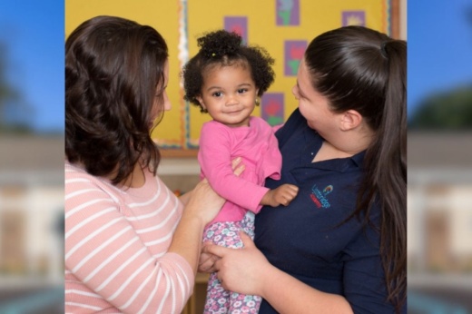 Lightbridge Academy staff holding child