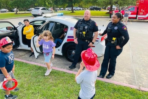 Precinct 4 officers interact with students.