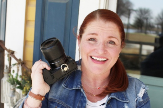 A woman holding a camera