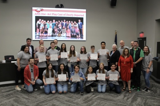 Image of students, board members and other school officials