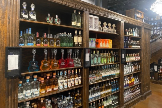wooden shelves of liquor bottles