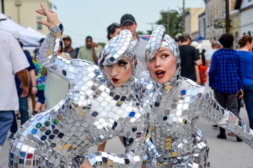 Two performers dress up in a disco ball-like outfit for Whimsy & Wonder.