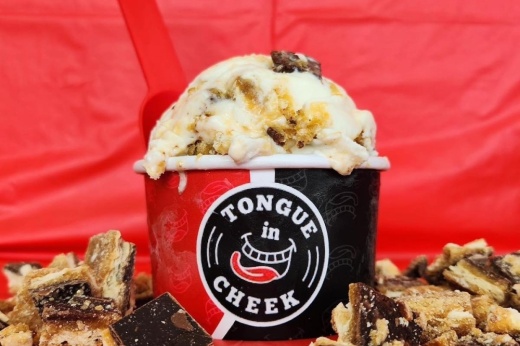 scoop of ice cream in a cup that says tongue in cheek