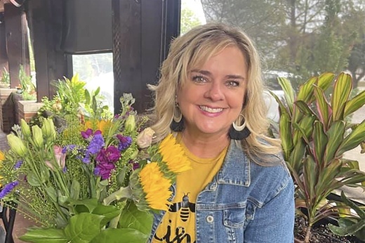 a woman holding flowers
