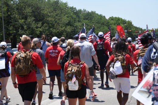 people walk outside for Carry the Load