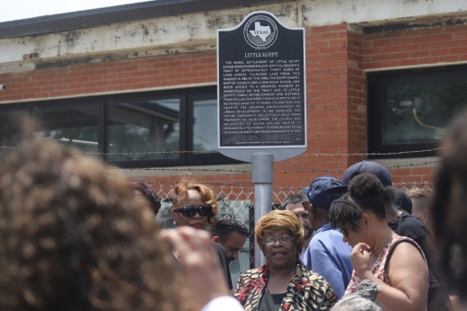 People posing in front of the Little Egypt historical marker