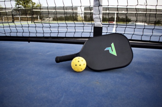 Pickleball paddle, net and ball