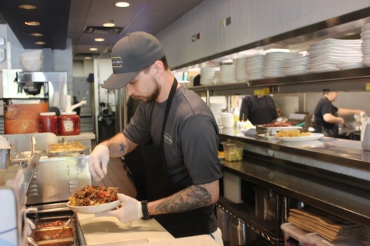 Brenton Hogan prepares food at J. Macklin’s Grill in Coppell.