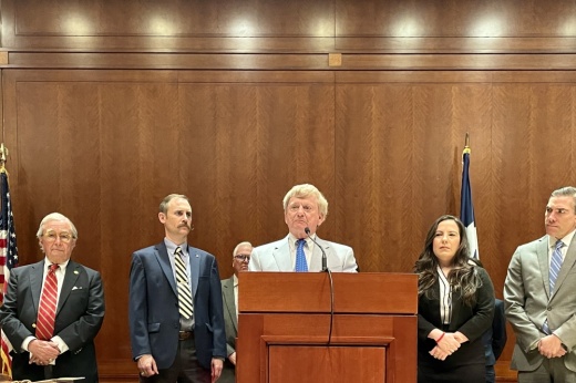 Attorney Dick DeGuerin (left) and Texas lawmakers listen as attorney Rusty Hardin (center) discusses the impeachment case into suspended Attorney General Ken Paxton.