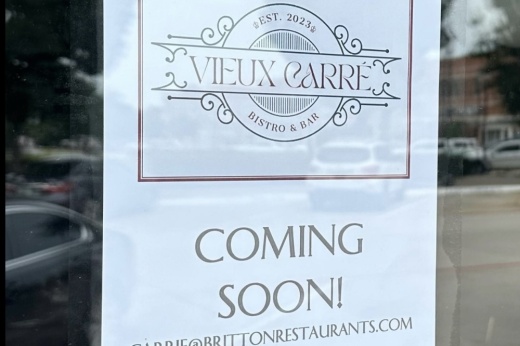 Sign reporting a new restaurant, Vieux Carré, coming to Parker Square