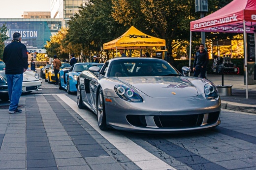 porshe parked on a busy street
