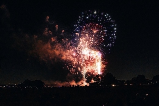 fireworks going off against a dark sky