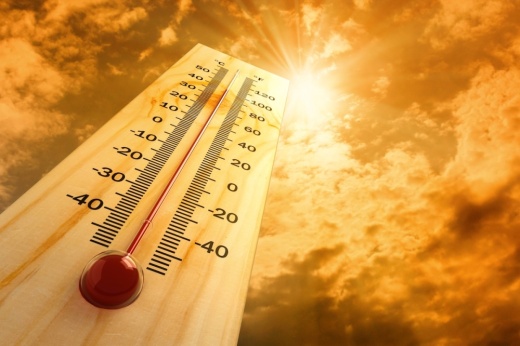 a thermometer pointing to the sun