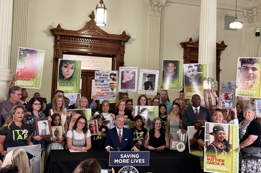 Gov. Greg Abbott (center) signs four bills aimed at combatting the fentanyl crisis on June 14 at the Texas Capitol.