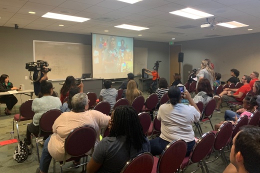 A crowd gathers in a newly introduced overflow room during a June 15 meeting of the Houston ISD board of trustees. The room was introduced as HISD officials limited the amount of people allowed to sit in the board room during the meeting. Public speakers spoke out against the state takeover of the district as well as the use of the overflow room. (Shawn Arrajj/Community Impact)