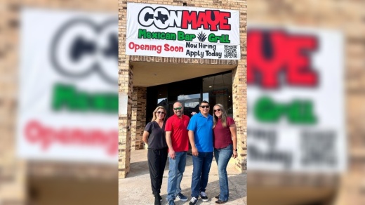 Four restaurant owners stand in front of a building with a sign that says conmaye mexican bar and grill