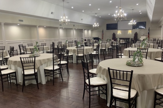 a large room with several chairs and tables