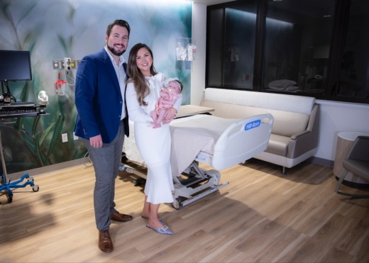 a family stands inside a hospital
