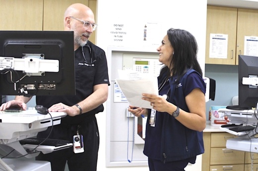 Critical care physician Dr. Jason Wagner talks with registered nurse Sylvia Tawadrous on May 19 at Methodist Stone Oak Hospital. They are among more than 4,800 professionals in Stone Oak’s health care sector. (Edmond Ortiz/Community Impact)
