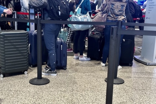 people wait in line at austin-bergstrom international airport