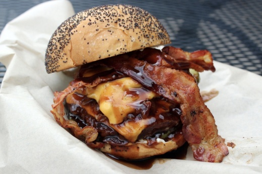 a burger with bacon and barbecue sauce