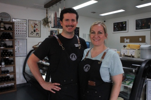 Bob and Rachel Pineda stand in their cheese shop