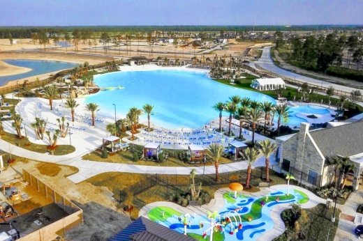 An aerial photo of Balmoral's Crystal Clear Lagoon and other amenities with houses in the background