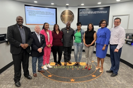 Missouri City Council standing in front of the Missouri City hall meeting room