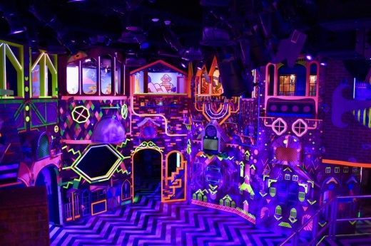 a dark room with neon colors