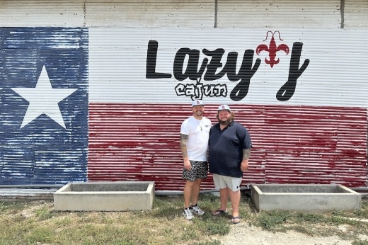 Owners Josh and Adam Smith stand in front of Lazy J Cajun.
