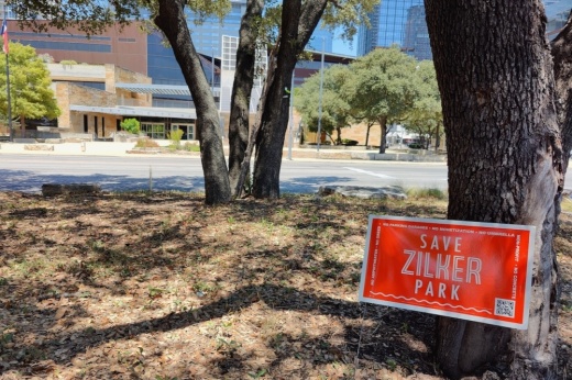 "Save Zilker Park" sign in front of Austin City Hall