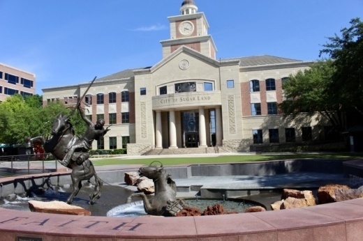 Sugar Land City Hall during daytime with elaborate fountain in front of building