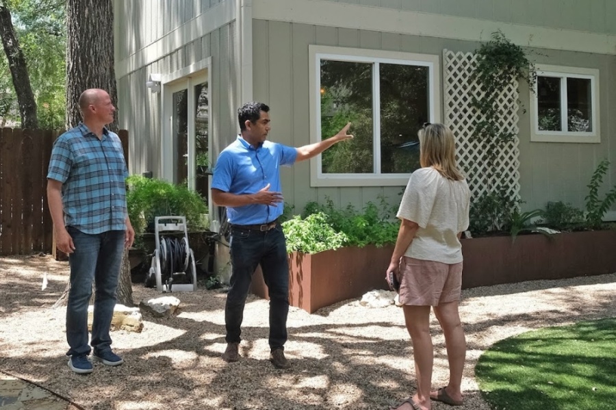 Bill and Sara Kauffman listen to Realtor George Castillo during a tour of a Southwest Austin home. (Nell Carroll/Community Impact)
