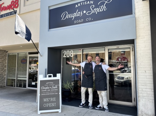 Owners Kevin and Michael Douglas-Smith stand outside their store on opening day. (Amira Van Leeuwen/Community Impact)