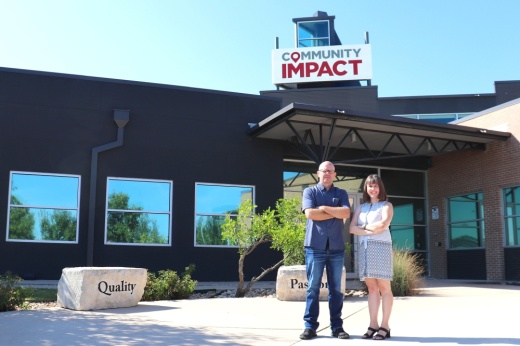 creative director derek sullivan and content director marie leonard stand in front of the community impact headquarters building in pflugerville texas with their hands folded across their chests