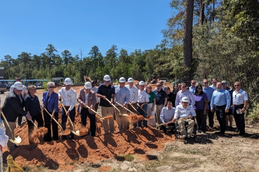 people with shovels of dirt