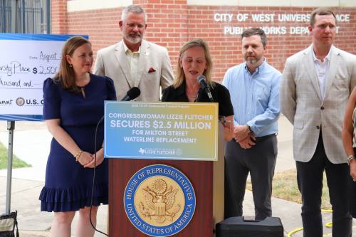 West University Place Mayor Susan Sample (center) speaks alongside U.S. Rep. Lizzie Fletcher, D-Houston (left) at an Aug. 21 news conference announcing $2.5 million in federal funding for a Milton Street water line replacement project. (Courtesy City of West University Place)