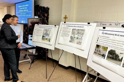Martha Castex-Tatum looks at charts on easels