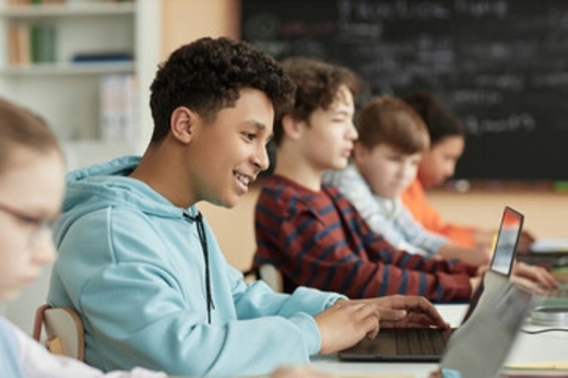 students in a classroom on laptops