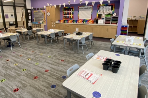 An empty elementary school classroom in Liberty Hill filled with tables and chairs
