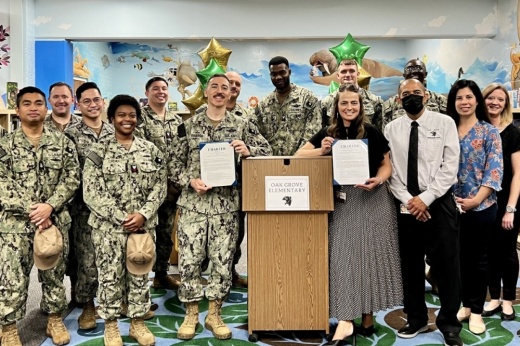 Representatives from Oak Grove Elementary School and the U.S. Navy sign a charter for the Military Adopt a School Program on Oct. 4, 2022. Thirteen North East ISD schools and 11 Northside ISD schools were recently designated a Purple Star Campus. (Courtesy NEISD)