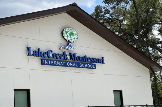 white and black school with LakeCreek Montessori sign