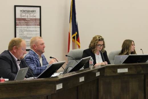 The photo shows Montgomery ISD trustees meeting on Aug. 21.