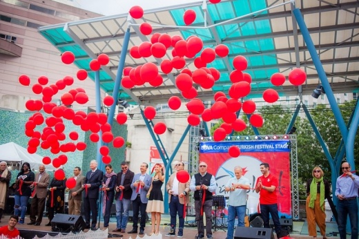 People release balloons on stage at the Houston Turkish Festival