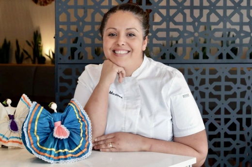 Chef Beatriz Martines at restaurant smiling