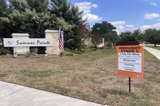 Summer Pointe neighborhood sign with Drought Stage 2 sign