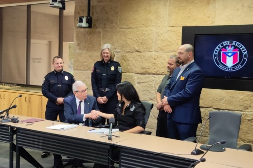 AEMSA president and city of Austin leaders signing a contract